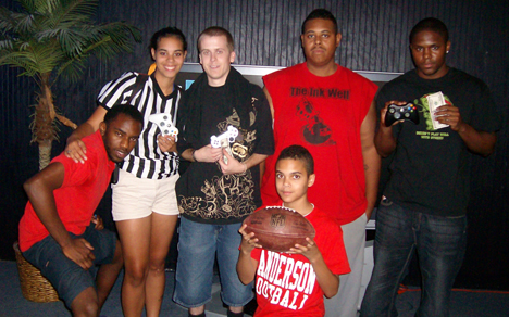 Winners VA's Finest (holding money on the left) and Alex Oden (holding money on the right).
